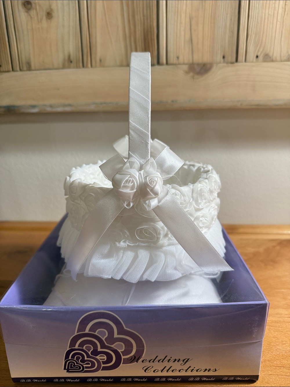 White Satin Flower Girl Basket with Ribbon Roses.